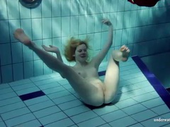 KiloMatures presents: Blonde goes for a swim and strips