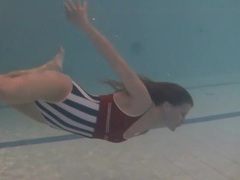 KiloMatures presents: Leggy girl swims and strips naked in pool
