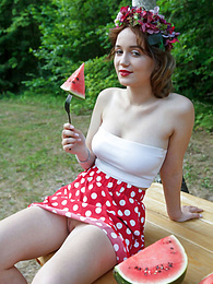 KiloMatures presents: Nice belarusian stunner Rokki removes all clothes on a blanket in a backyard